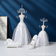 Elegant white stand holding various jewellery pieces