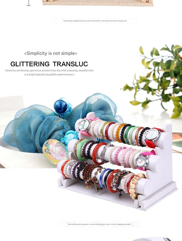 angled view of three-tier jewelry stand