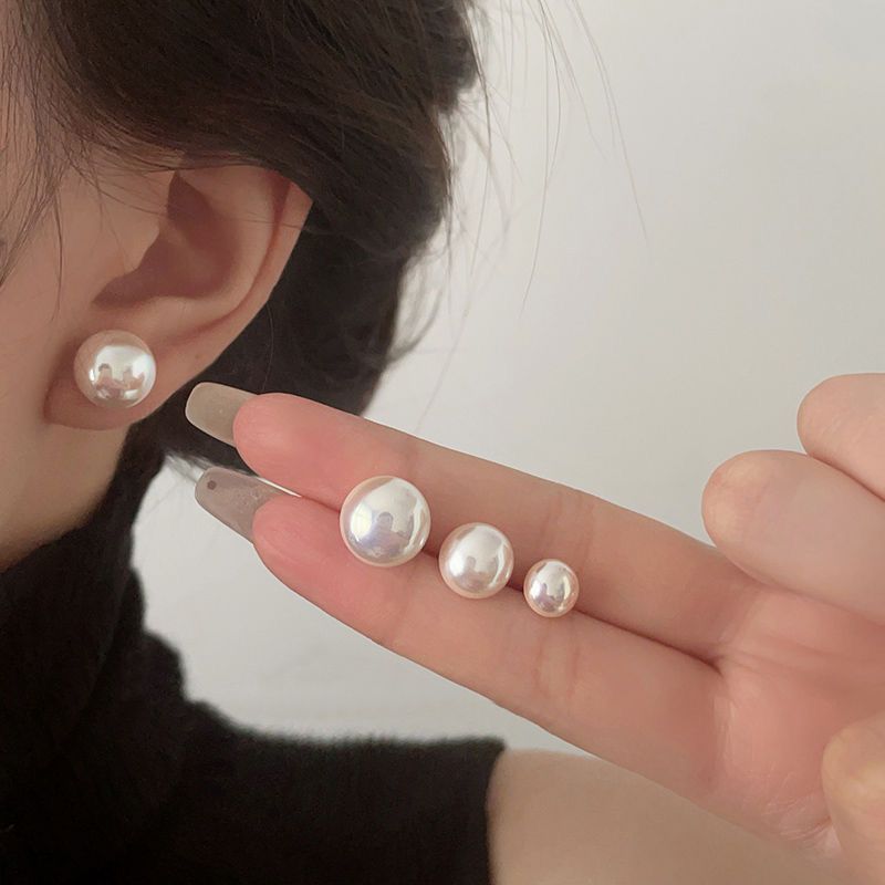 Close-up view of Pearl Stud Earrings - Image 2