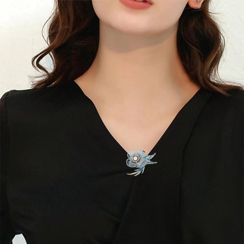 Close-up of charming animal design on brooch