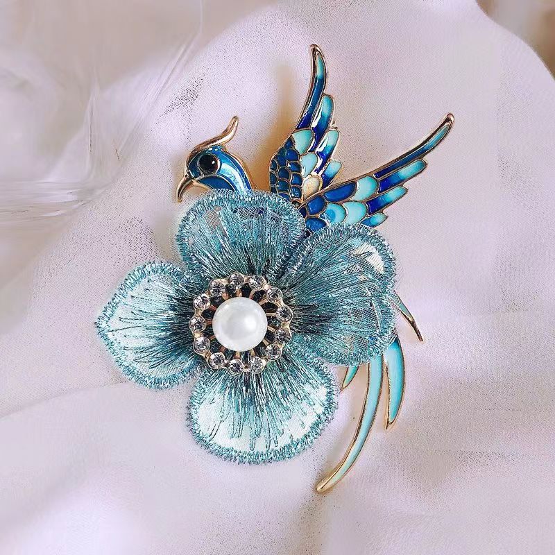 Stylish brooch in blue phoenix colour