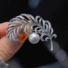 Feather Brooch Pin Next to Jewellery Box