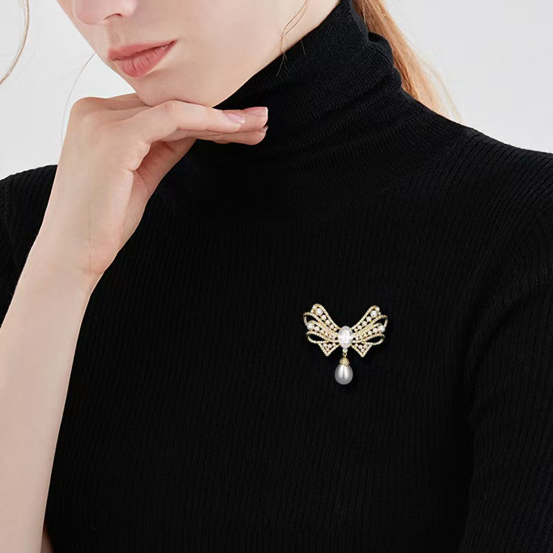 Stylish pearl brooch close-up