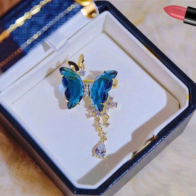 Elegant butterfly brooch showcased on a dress