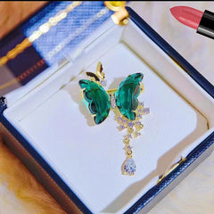 Butterfly brooch with vibrant green and blue colours