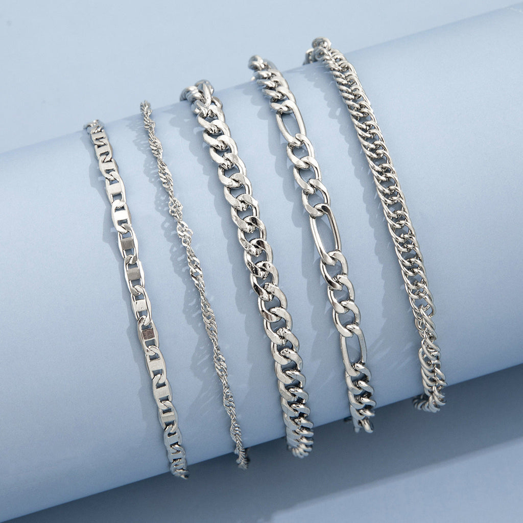 Elegant metal anklet worn on a woman's ankle