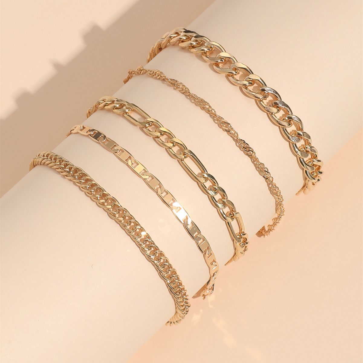 Elegant metal anklet worn on a woman's ankle