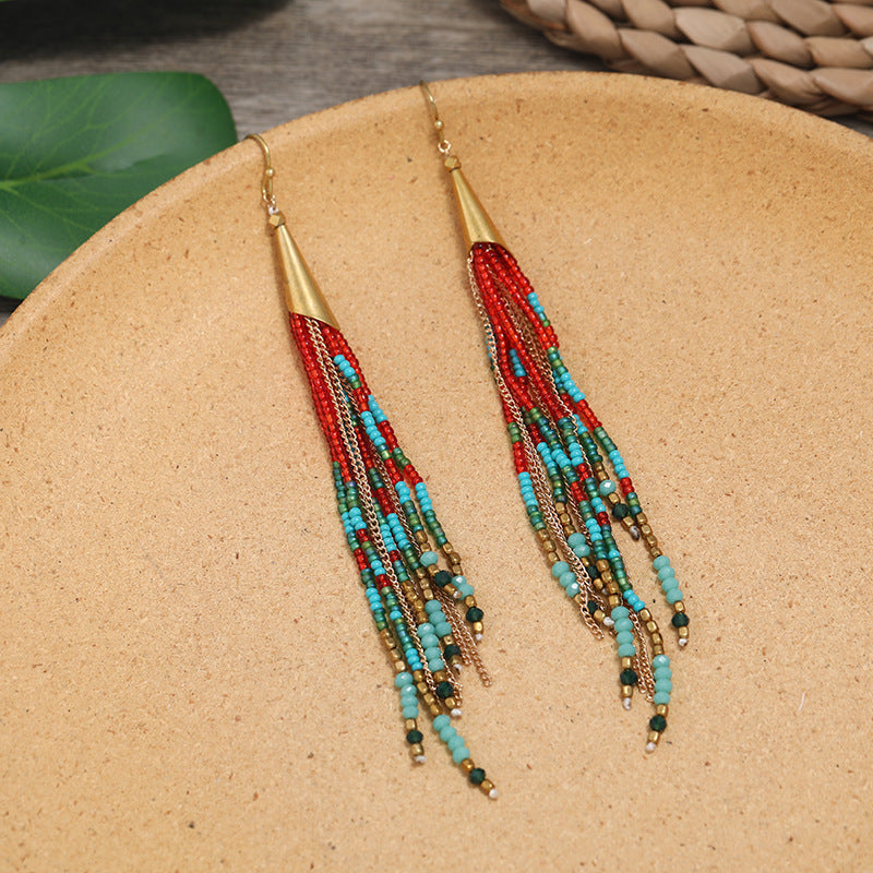 Close-up of vintage chic long tassel earrings