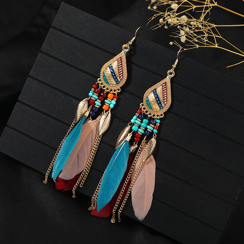 Bohemian feather tassel earrings in vibrant blue