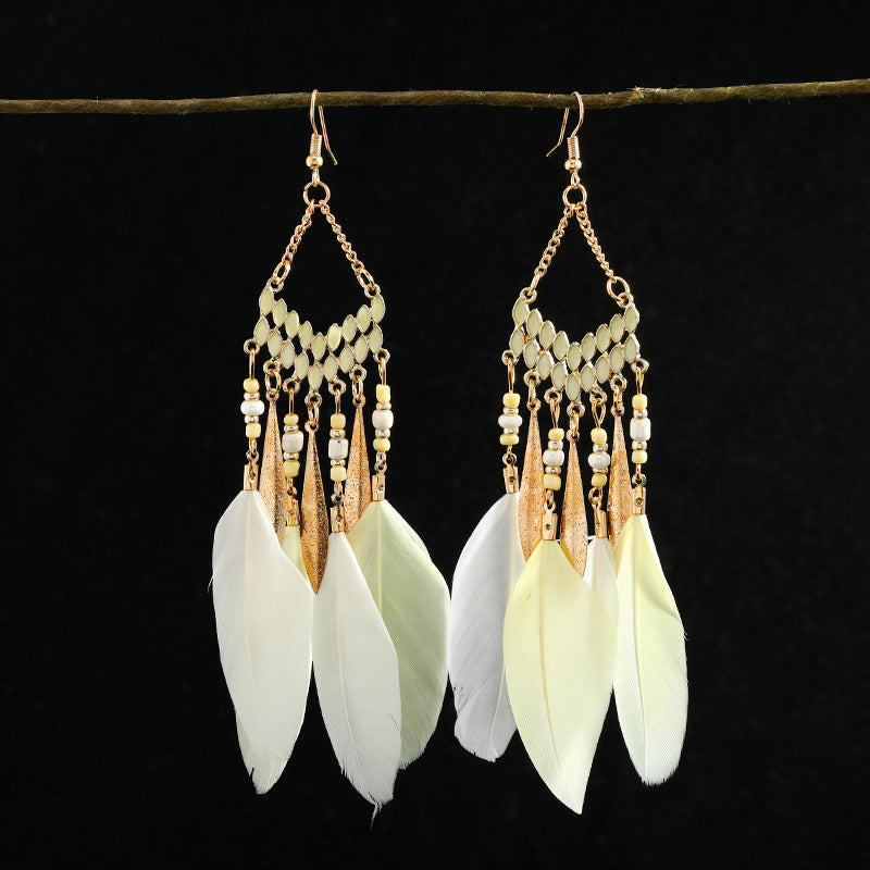 Handcrafted earrings with feather details