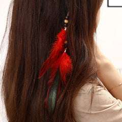 Handmade feather hair accessory with chic tassels