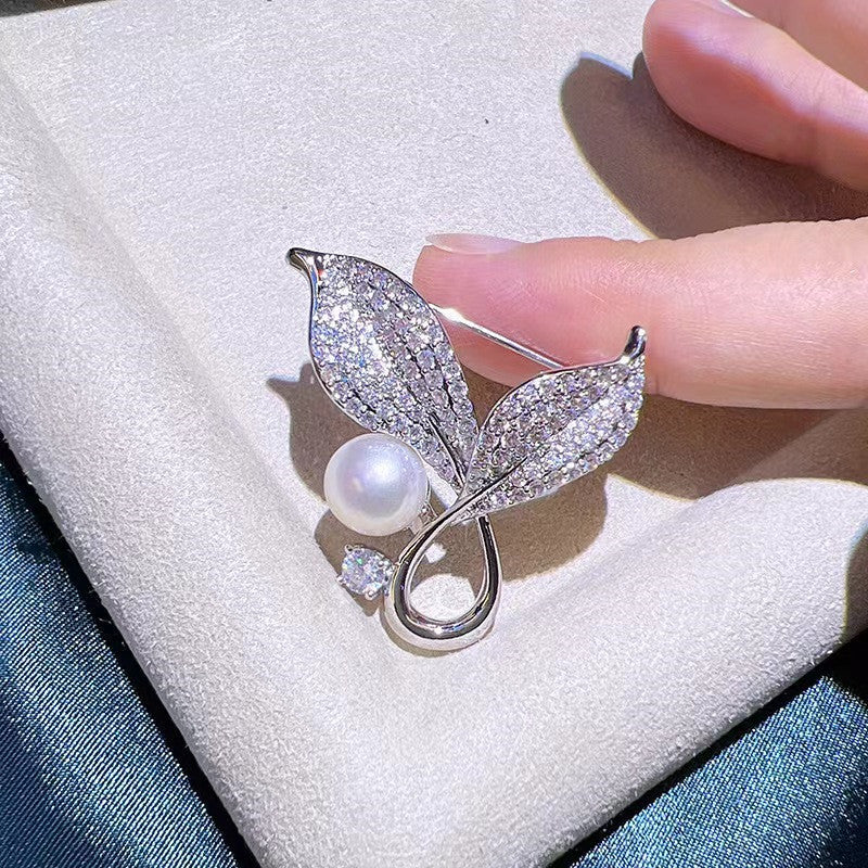 Stylish brooch worn on a dress showcasing its elegance