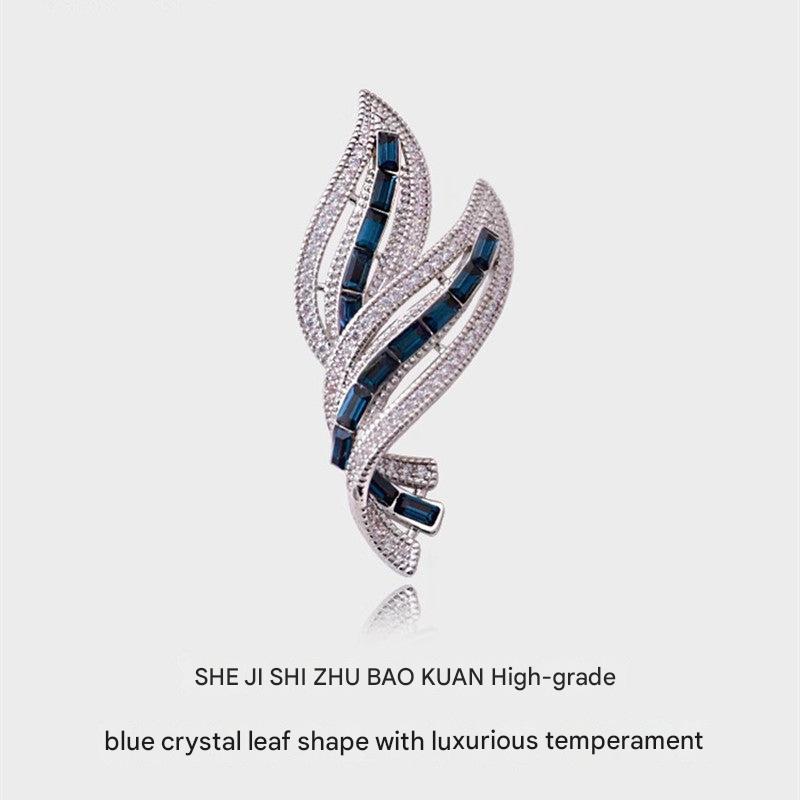 elegant leaf brooch displayed on a mannequin