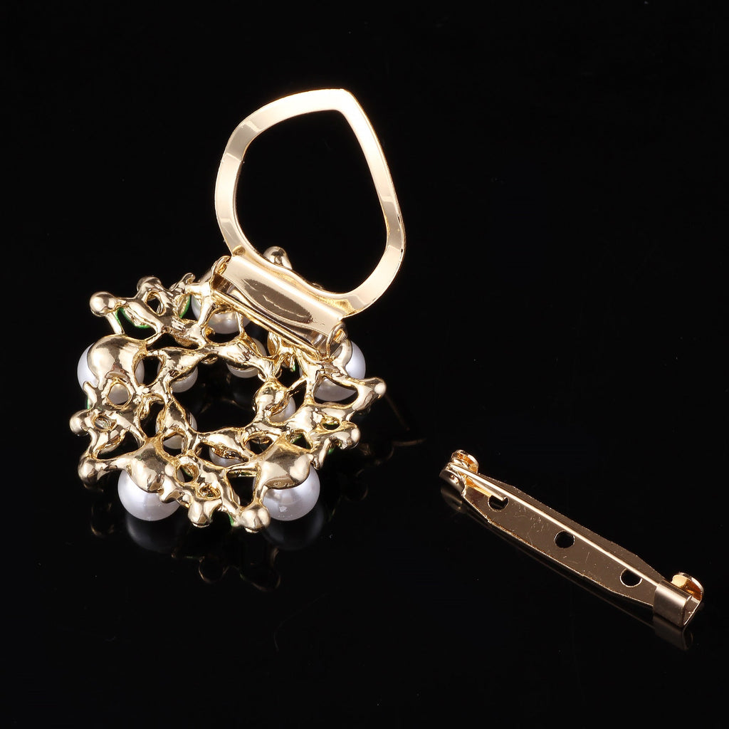 Elegant Floral Pearl Brooch Pin showcased on fabric