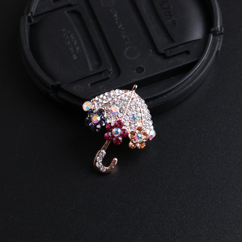 Rhinestone brooch on a scarf display
