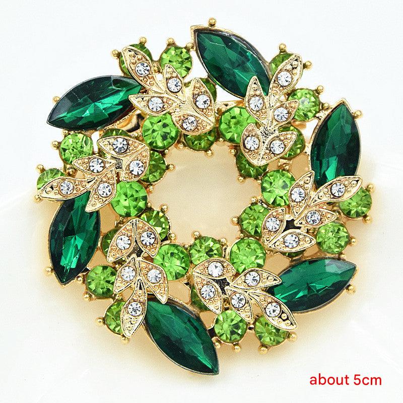 Floral brooch displayed on a cardigan