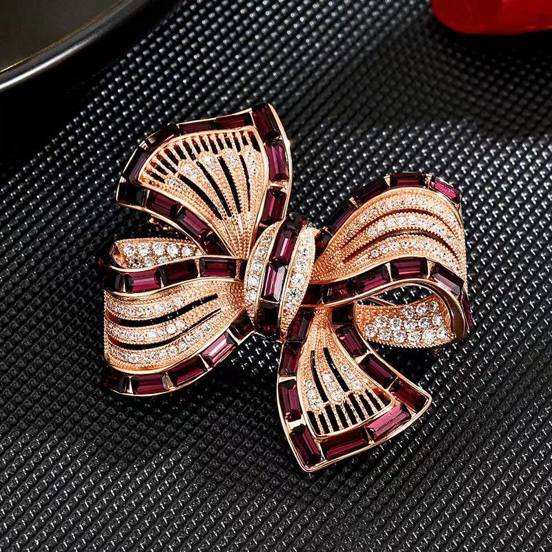 Butterfly Knot Brooch showcased on an elegant cloth