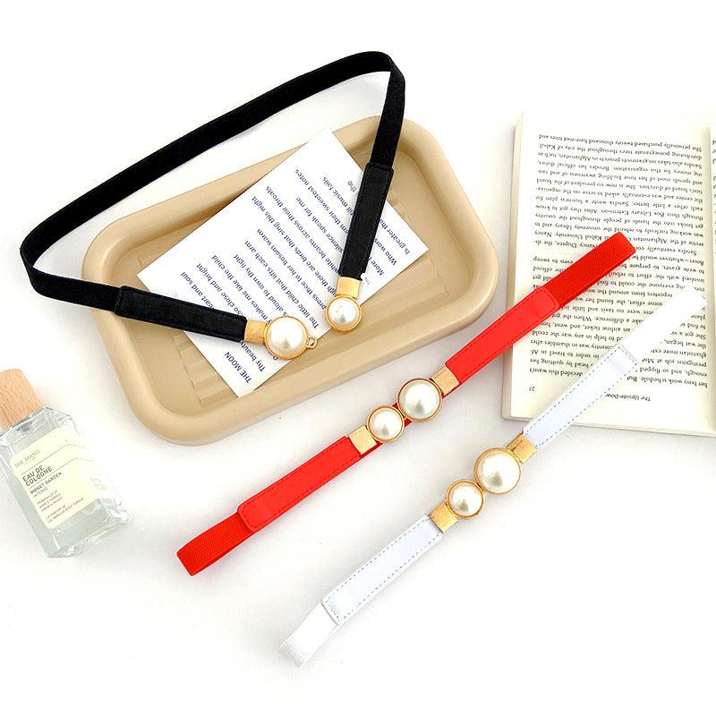Elegant pearl buckle women's waist belt on white background