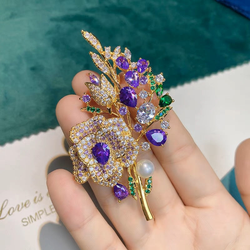 Close-up view of rhinestone details on floral brooch
