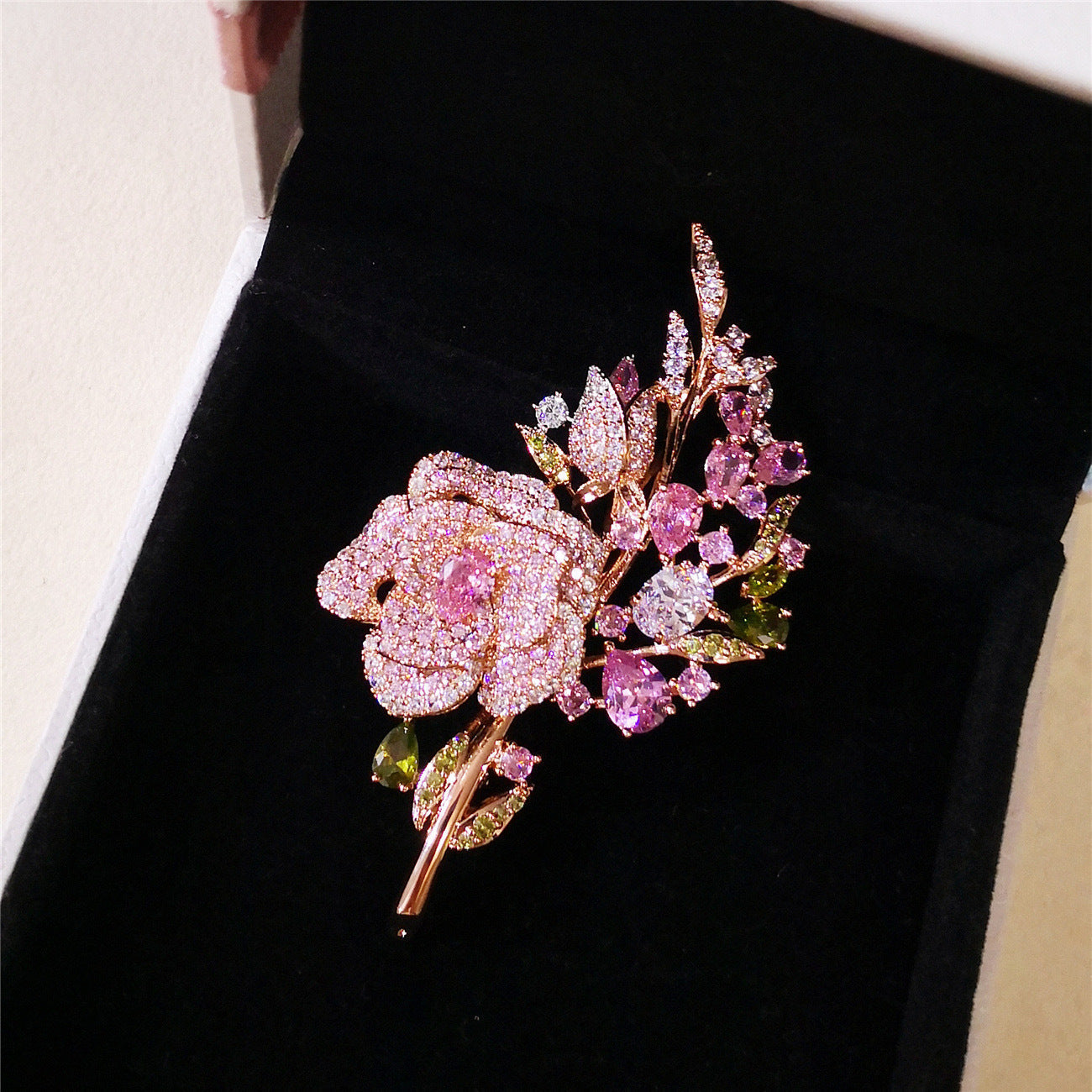 Different angles of the floral brooch design