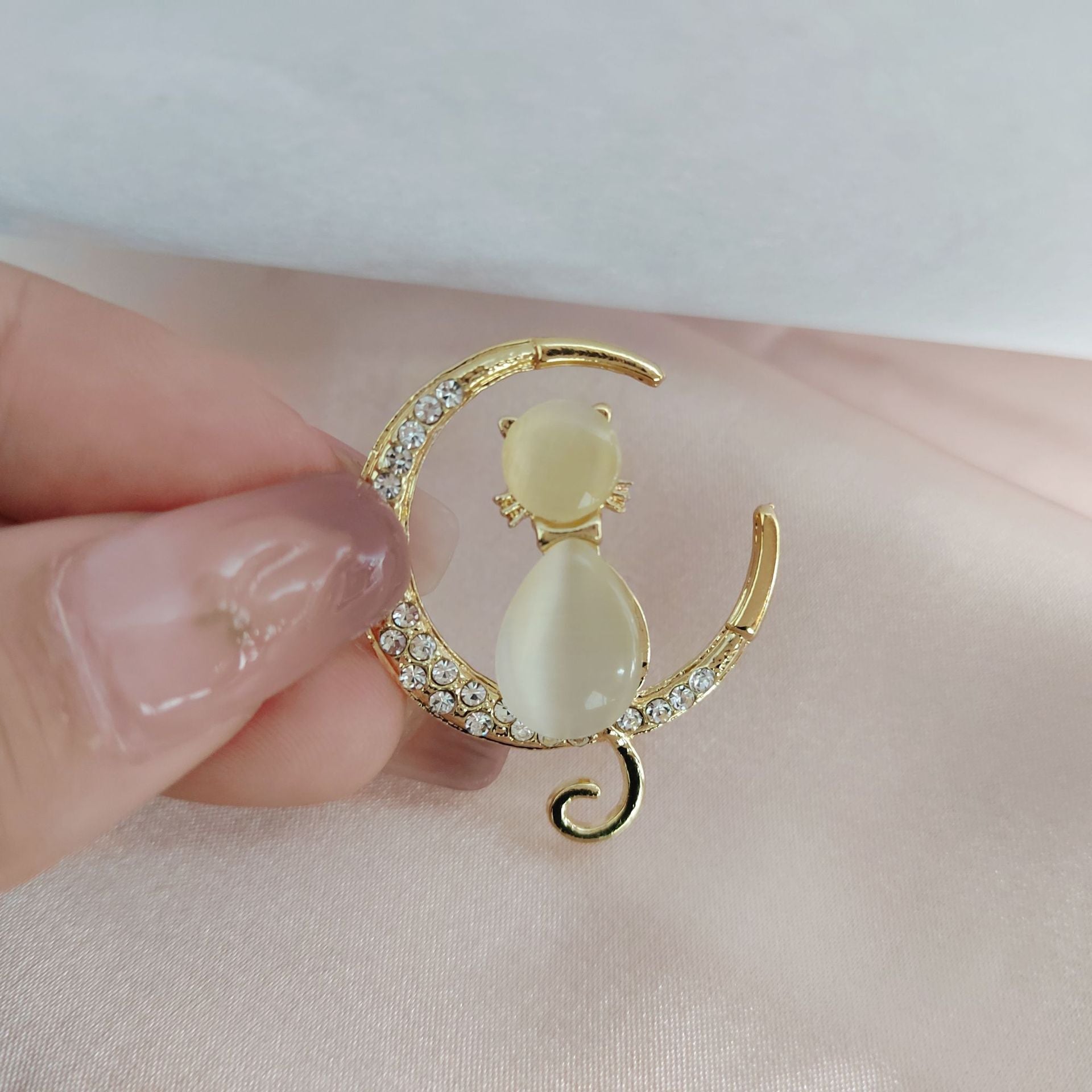 Stylish cat eye diamond brooch on display