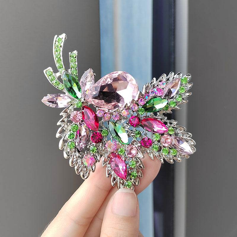Purple floral brooch on display