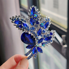 Different colour options for floral brooch