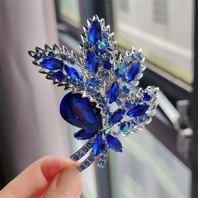 Different colour options for floral brooch