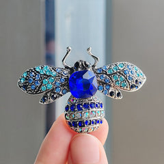 Close-up detail of the bee brooch