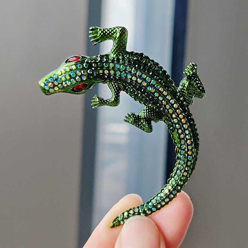 Crocodile brooch displayed against a neutral background
