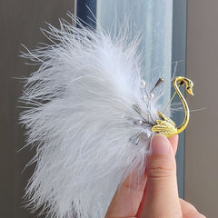 Vintage animal brooch displayed on jacket