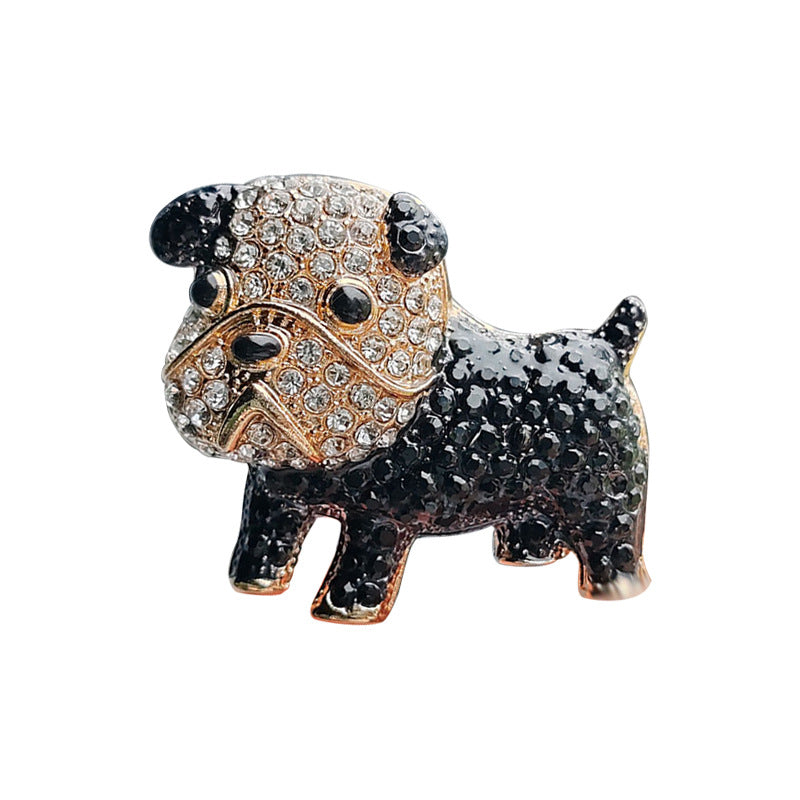 Brooch resting on fabric to show colour details