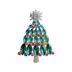 Green Christmas brooch on a stylish sweater