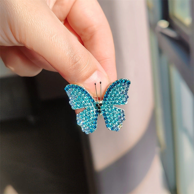 Butterfly brooch worn on a cardigan