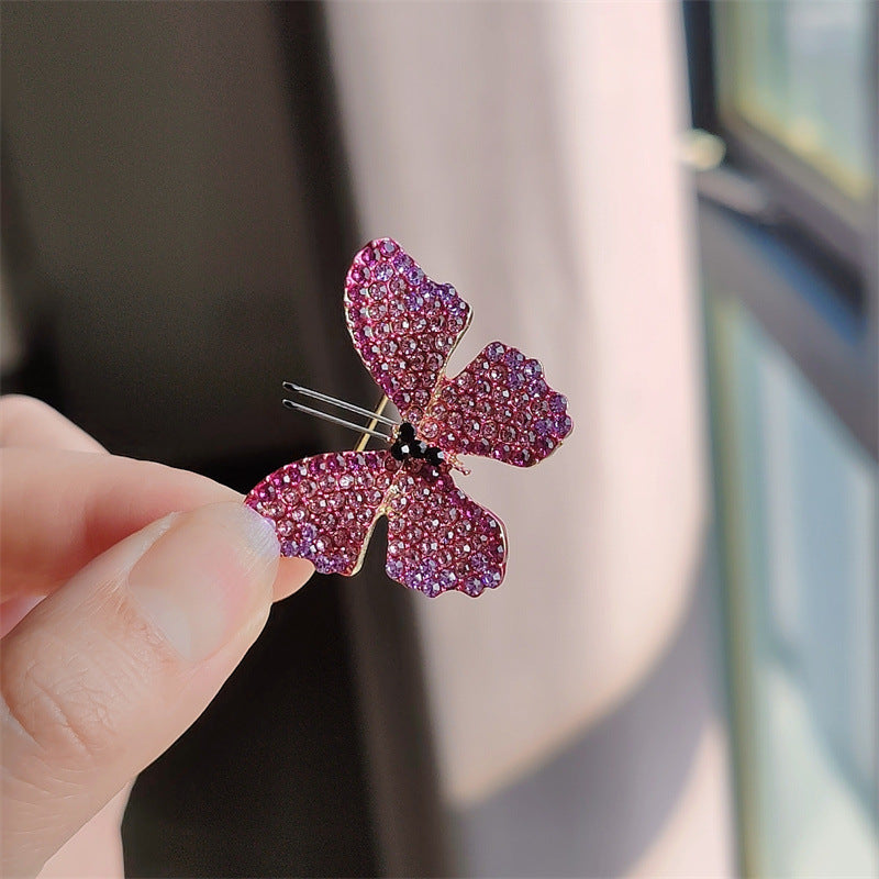 Butterfly brooch with sparkling rhinestones on display