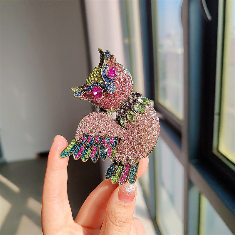 brooch shown on a dark backdrop