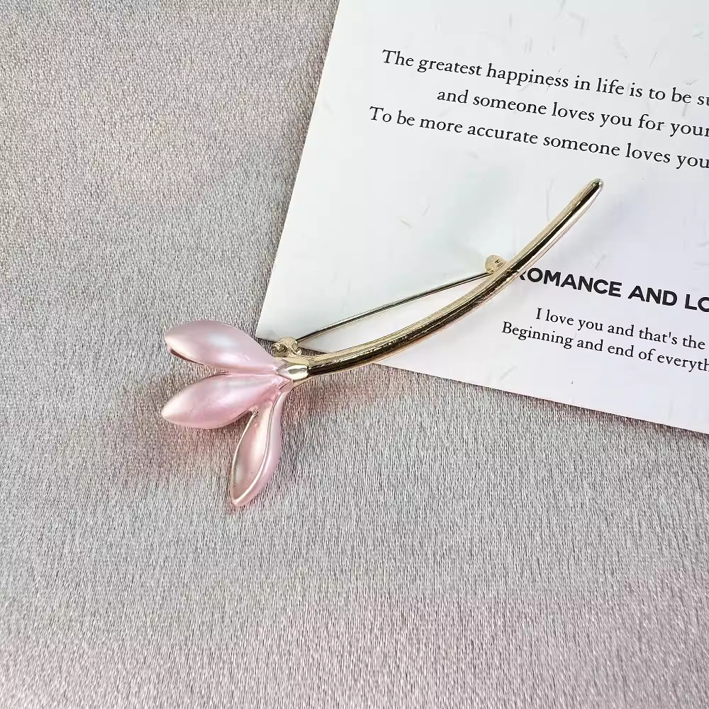 Elegant lotus flower pin worn on a jacket