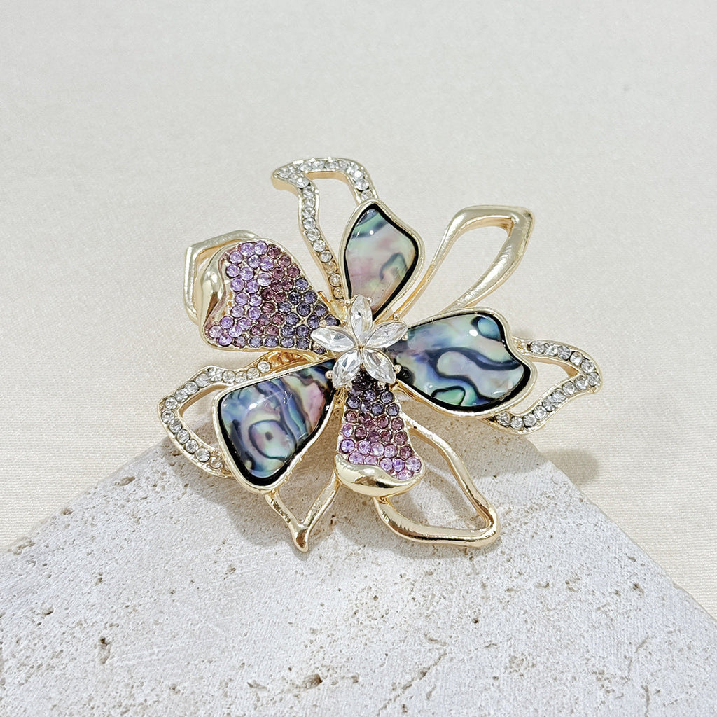 Elegant brooch accessory displayed on a sweater