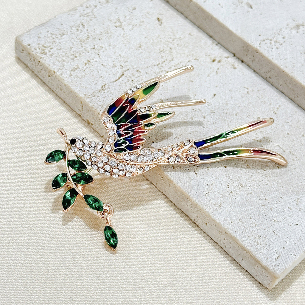 Elegant swallow brooch styled with a dress