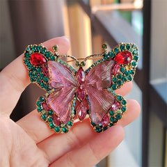 Close-up of butterfly brooch in vibrant green