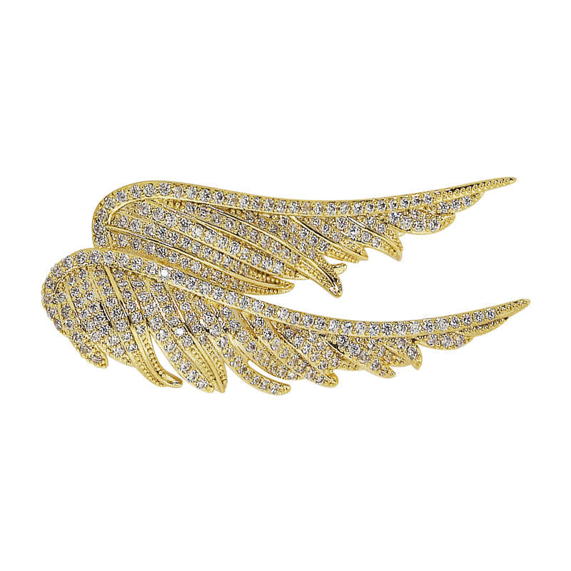 Fashionable woman wearing an angel wings brooch