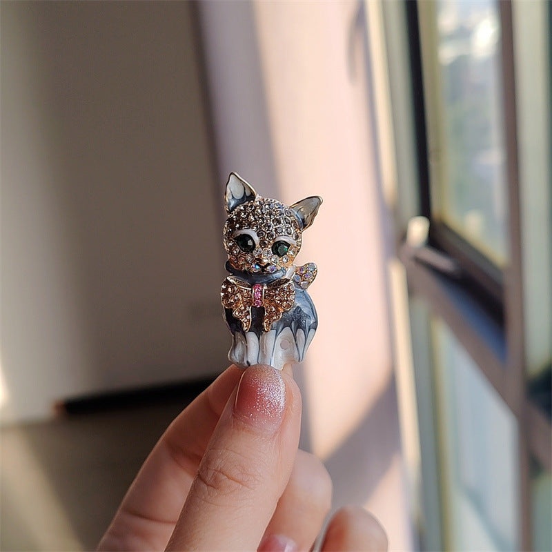 Vibrant alloy cat pin design on white background