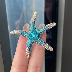 Close-up of rhinestone embellished starfish pin