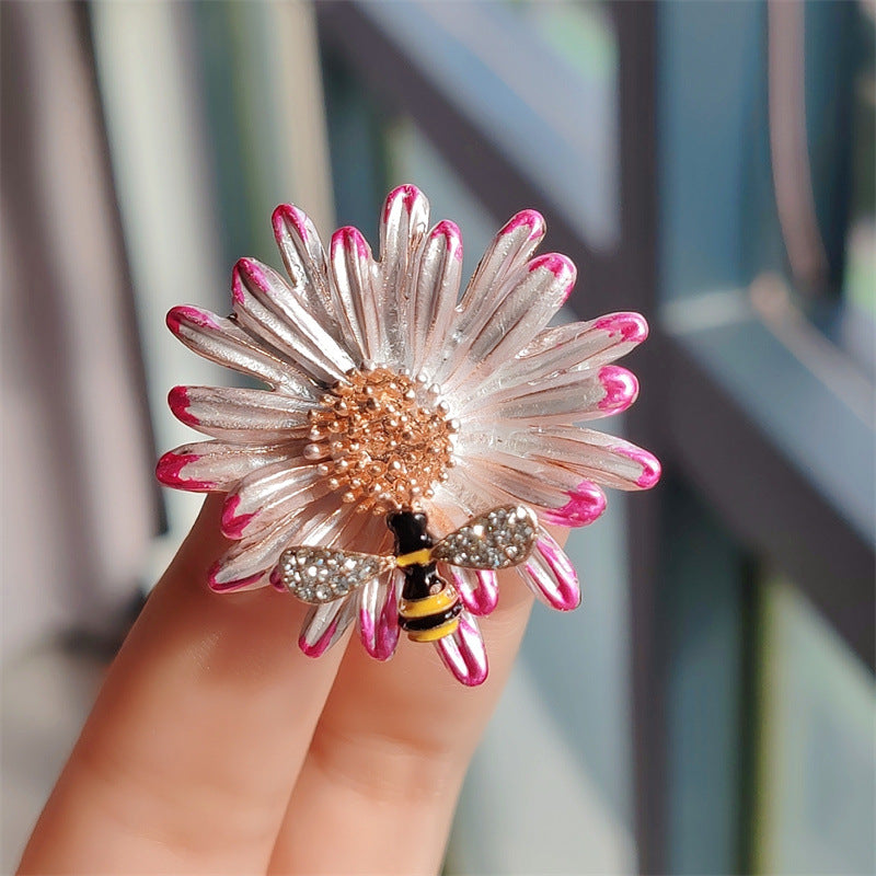 Purple daisy brooch pin displayed elegantly
