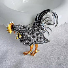 Side view of elegant grey rooster brooch design