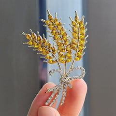 Chic brooch displayed on a wooden background