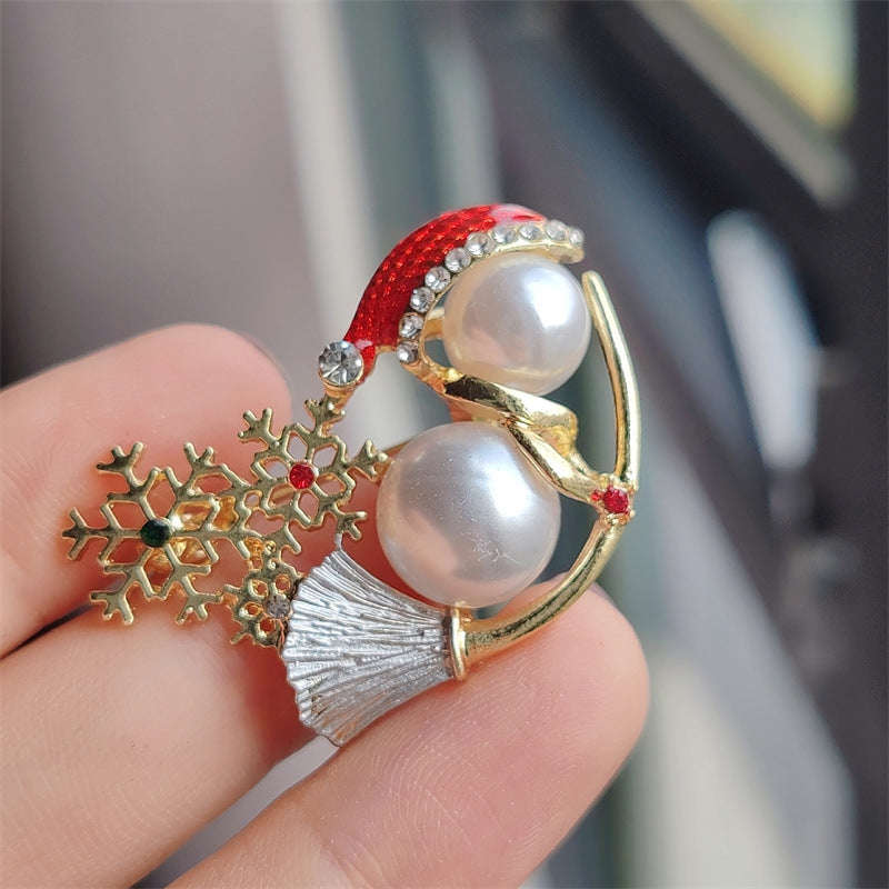 Close-up of Cute Christmas Pearl Snowman Brooch