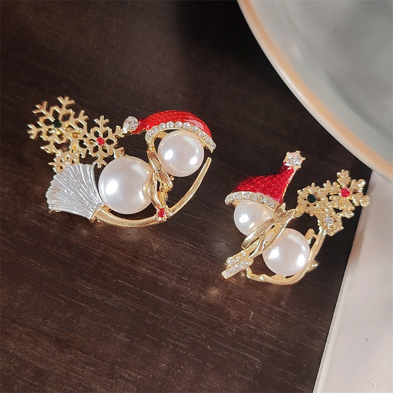 Snowman Brooch styled on a fitted jacket