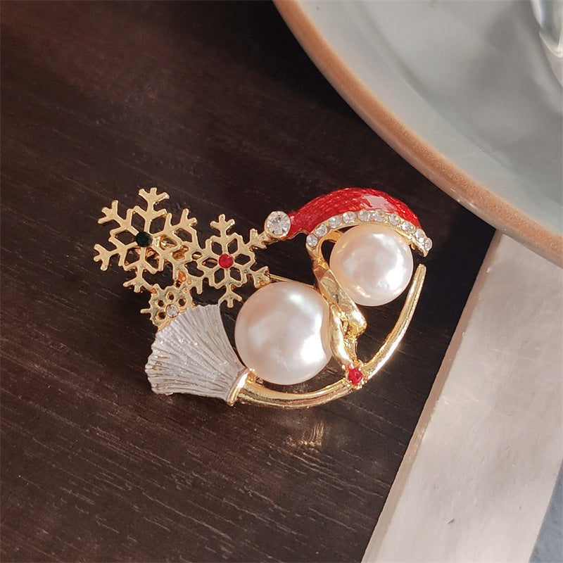 Snowman Brooch styled on a fitted jacket