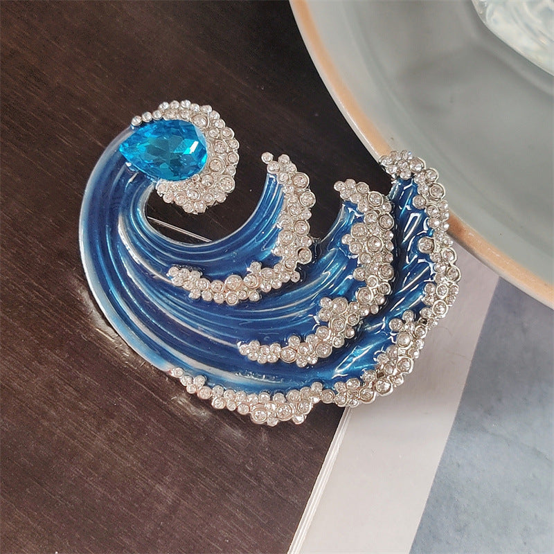 Wave design brooch on display